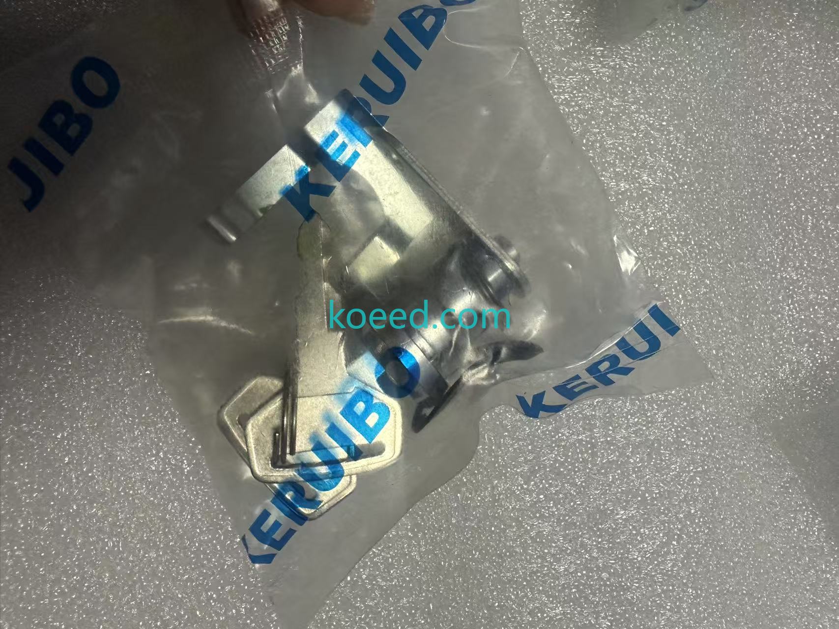 Kobelco cab door lock assembly mechanism