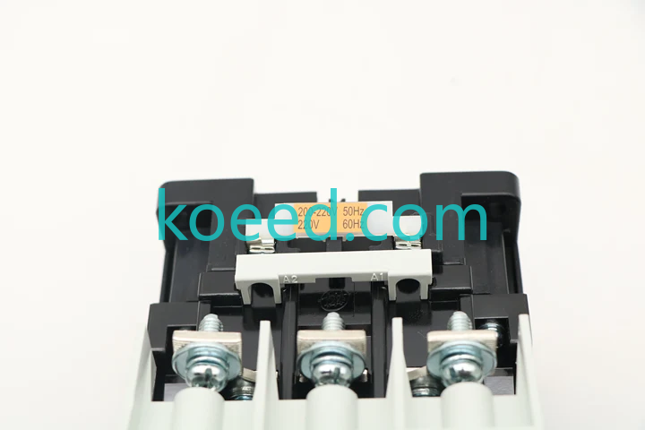 Reviewed photograph 1: contactor coil-terminal area with A1 / A2 markings, three large screw terminals and a partly obstructed orange coil label that includes 220 V.